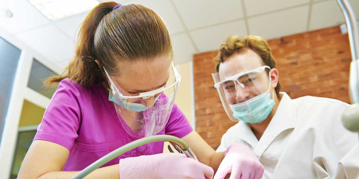 Two Dentists with patient